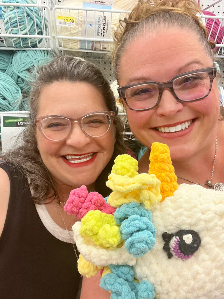 Marly Bird and Robyn Chachula in a yarn store with Sparkle!